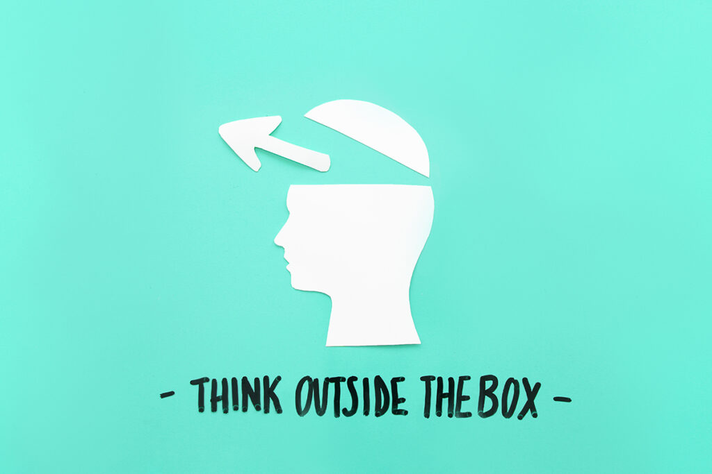 open human brain with arrow symbol near think outside box message